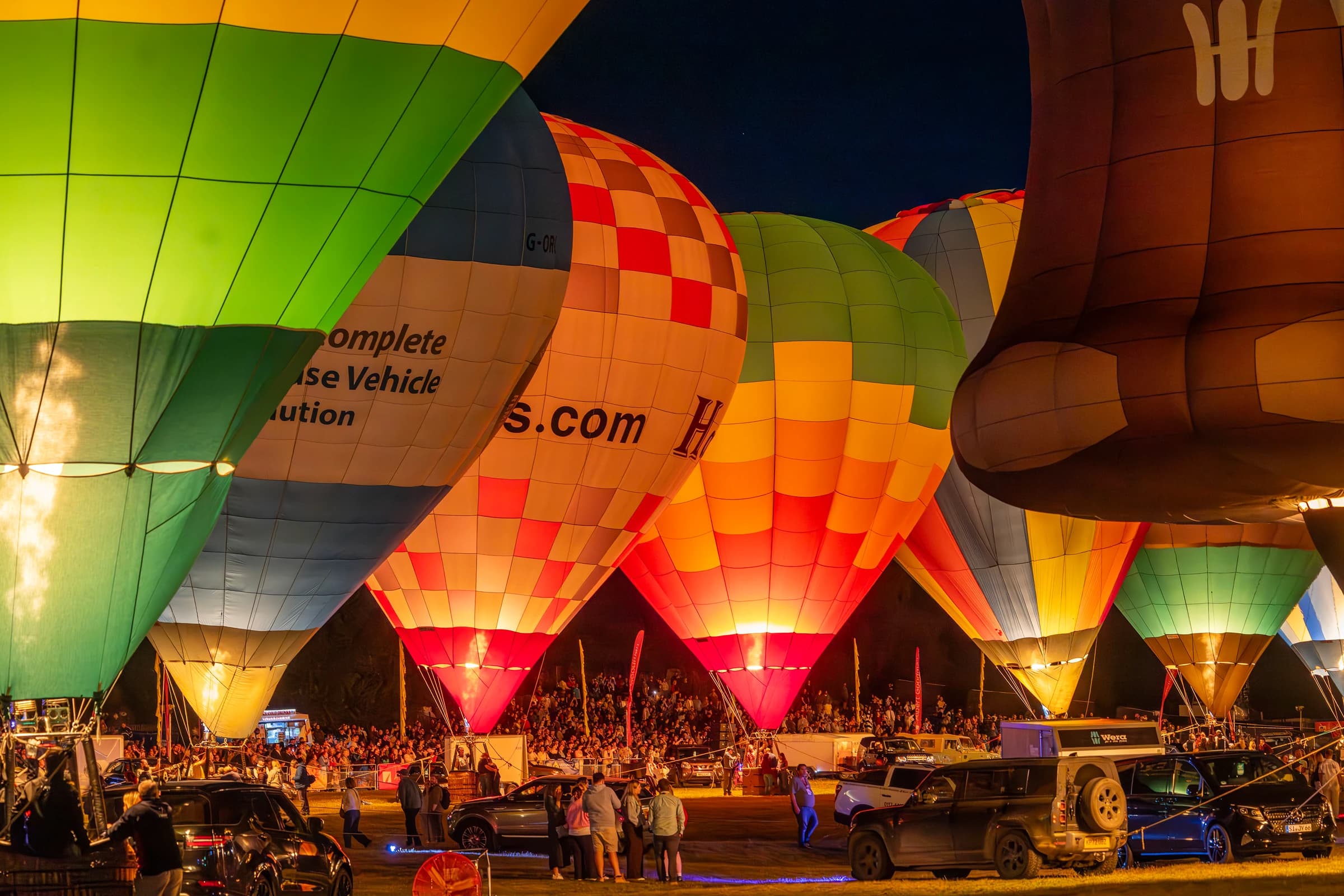 Hot air balloons lighting up at night