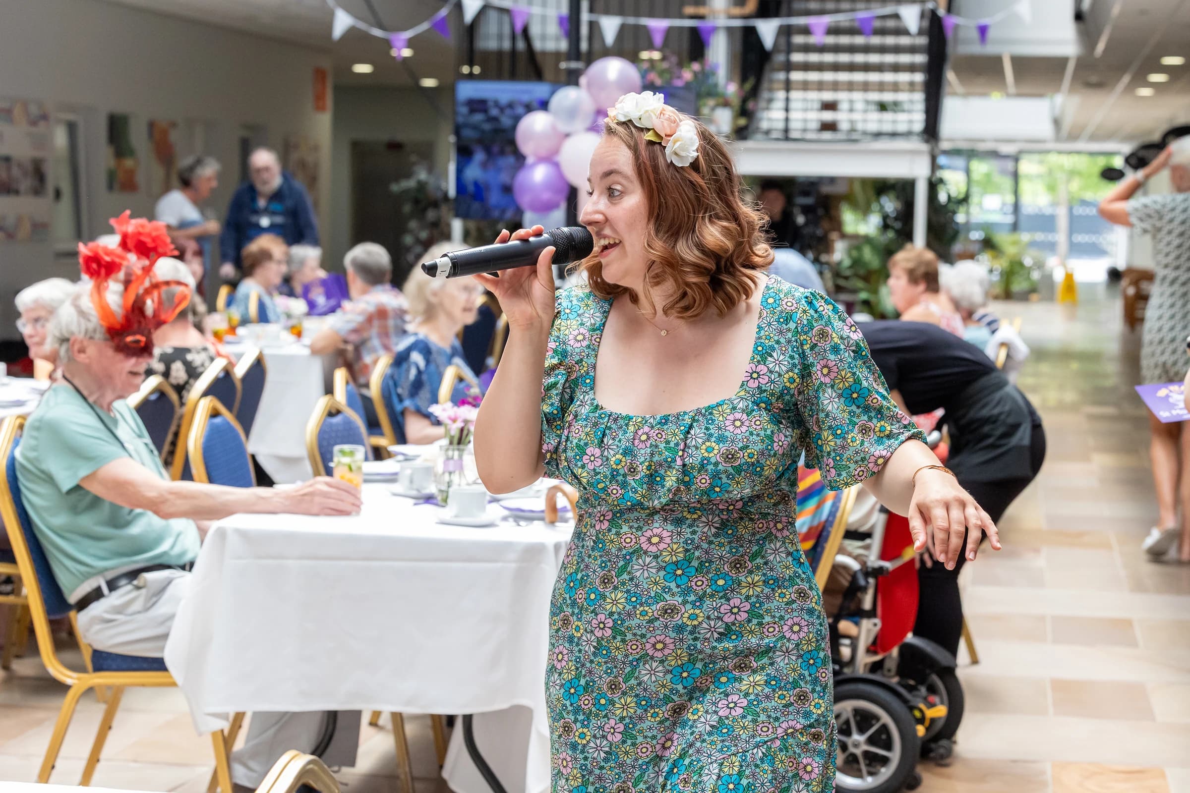 Women singing to a crowd