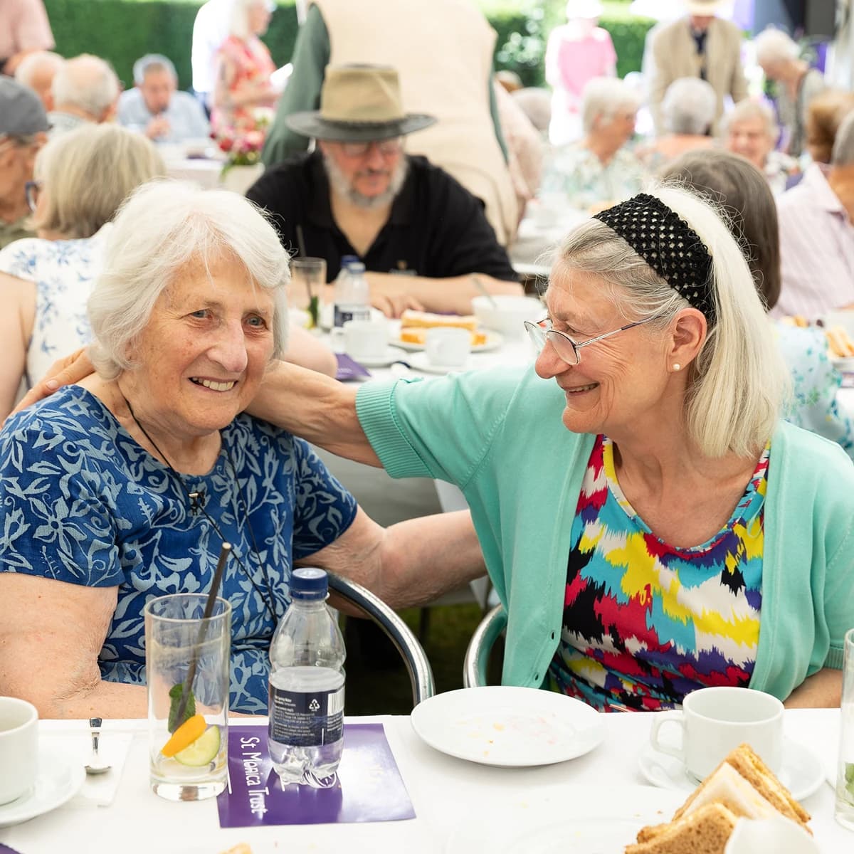 Two elderly women celebrating