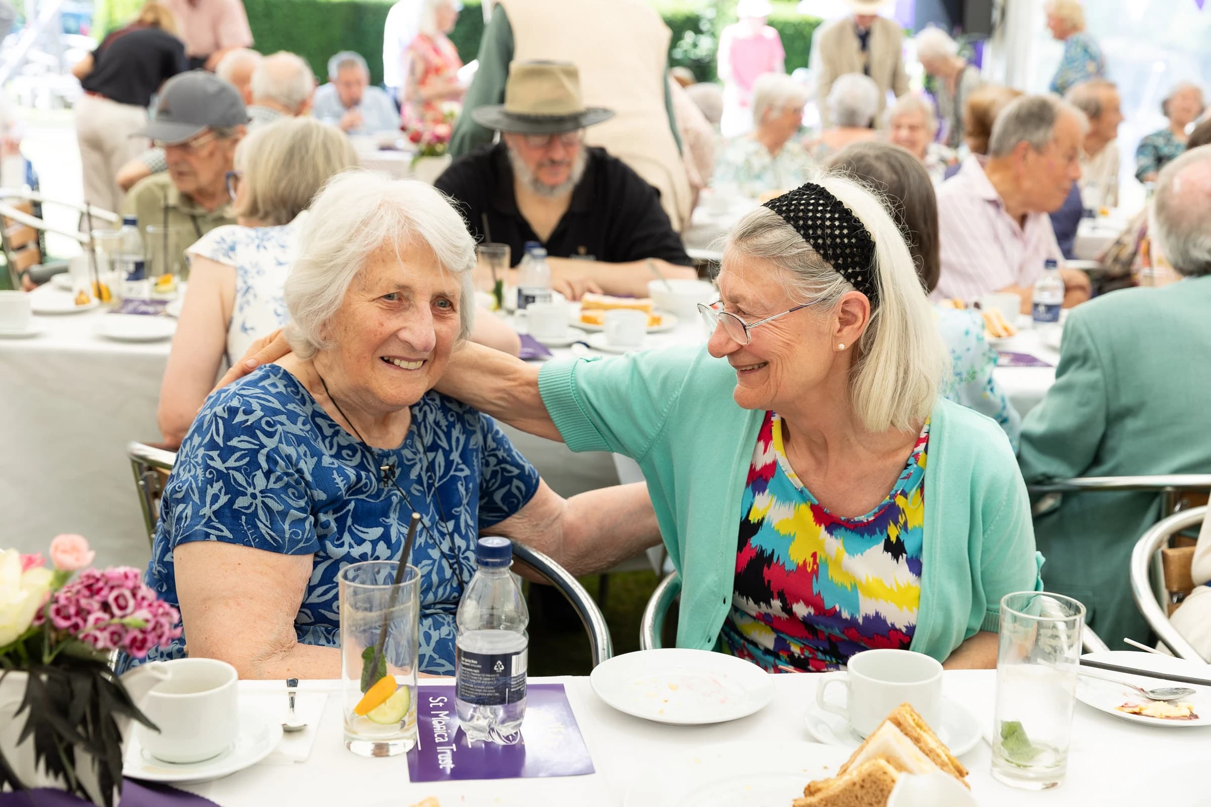Two elderly women celebrating